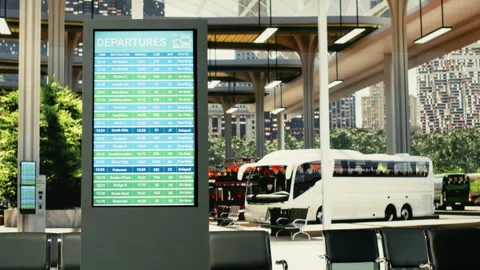 Spacious urban coach station with empty seats and digital departure board Stock Footage 334728379