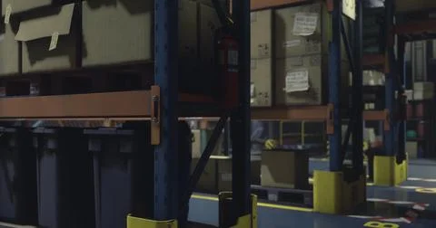 A spacious warehouse features tall metal shelving filled with cardboard boxes Stock Illustration