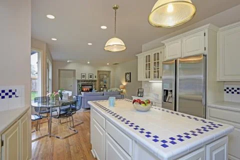 Spacious white kitchen interior with new Stainless steel appliances and tons  Stock Photos