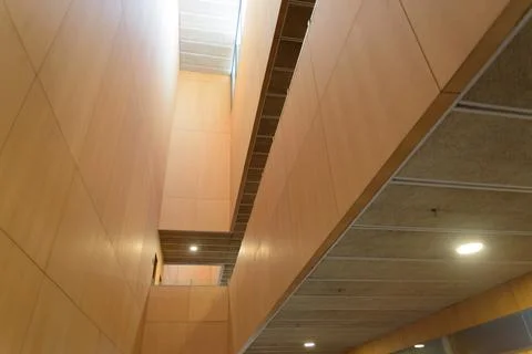 Spacious wooden interior featuring plenty of natural light and modern design. Stock Photos