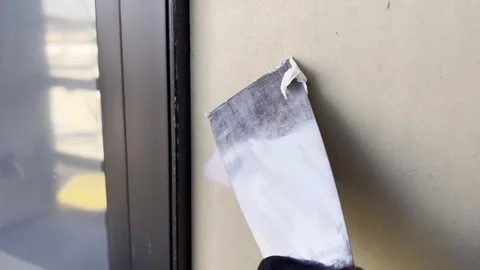 Spackling a small hole in wall 스톡 동영상 332690827