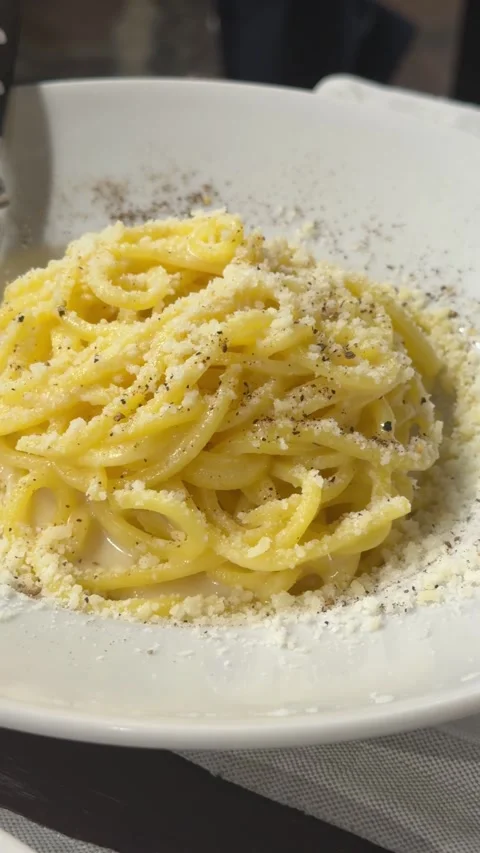 Spaghetti alla Cacio e Pepe Beautiful Pasta Dish in Italy. Restaurant Quality Ye Stock Footage 345016028