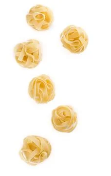 Spaghetti and basil isolated on white background. Stock Photos