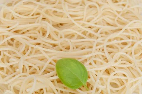 Spaghetti and basil leaf Stock Photos