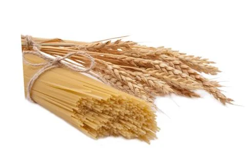 Spaghetti and ears of wheat Stock Photos