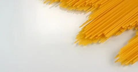 Spaghetti appear on a white background. Close up macro view, shot on RED 6K Stock Footage 107922271