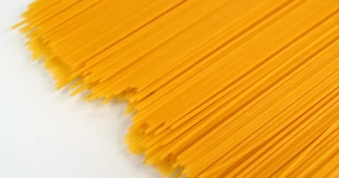 Spaghetti appear on a white background. Close up macro view, shot on RED 6K Stock Footage 107922874