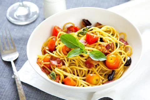 Spaghetti with bacon and dried chilli Stock Photos
