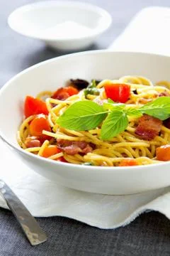 Spaghetti with bacon and dried chilli Stock Photos