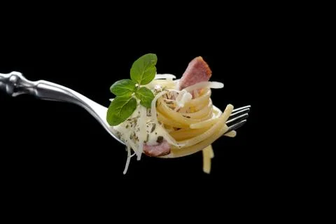 Spaghetti with bacon on fork Stock Photos