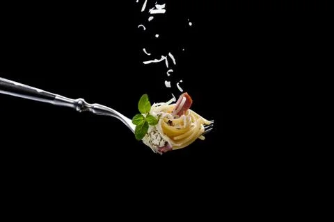 Spaghetti with bacon on fork Stock Photos