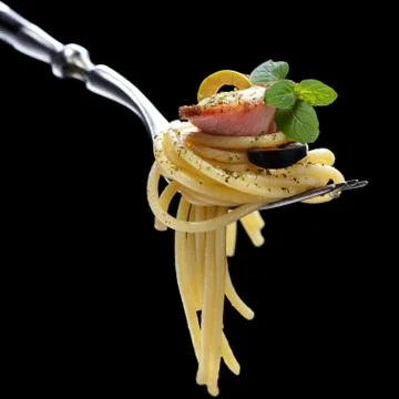 Spaghetti with bacon on fork Stock Photos