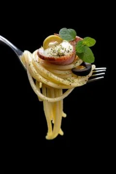 Spaghetti with bacon on fork Stock Photos