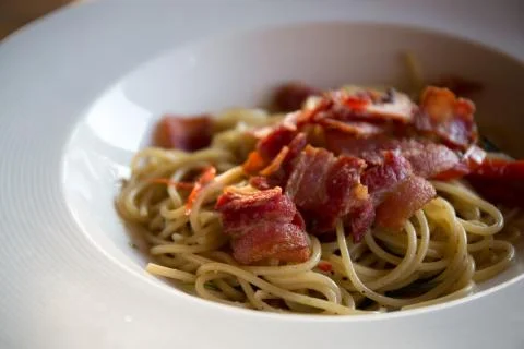 Spaghetti with bacon Stock Photos