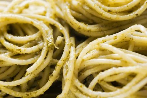 Spaghetti in basil pesto sauce Stock Photos