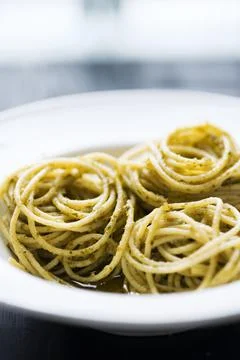 Spaghetti in basil pesto sauce Stock Photos