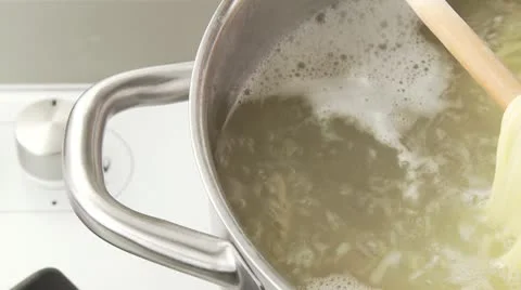 Spaghetti being cooked and tested to see if it's done Stock Footage 24634712