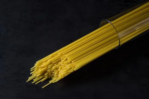 Spaghetti on a black background.  Stock Photos