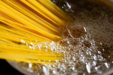 Spaghetti in a boiling water Photos