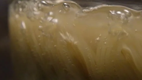 Spaghetti in boiling water. Spaghetti in a transparent pan with boiling water Stock Footage 283815895