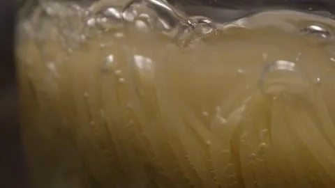 Spaghetti in boiling water. Spaghetti in a transparent pan with boiling water Stock Footage 307314313