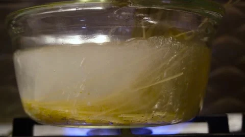 Spaghetti in boiling water. Spaghetti in a transparent pan with boiling water Stock Footage 317402891
