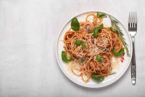 Spaghetti bolognese with basil and parmesan Stock Photos