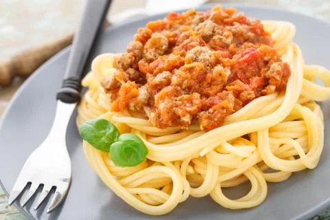 Spaghetti bolognese with basil leave Stock Photos