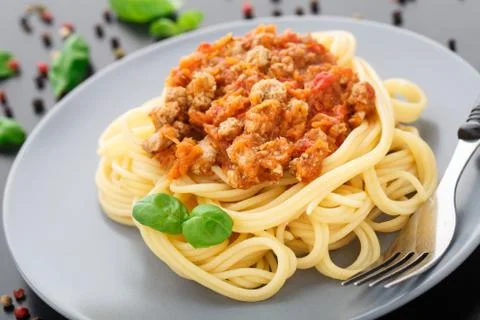 Spaghetti bolognese with basil leave Stock Photos