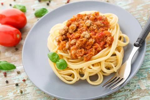 Spaghetti bolognese with basil leave Stock Photos