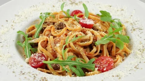 Spaghetti Bolognese with cherry tomatoes (loop) Stock Footage 57951308