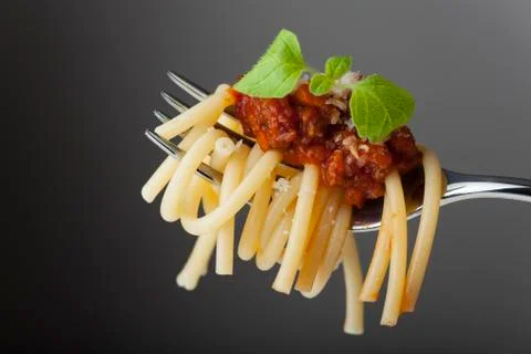 Spaghetti with bolognese on a fork Stock Photos