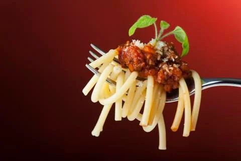 Spaghetti with bolognese on a fork Stock Photos