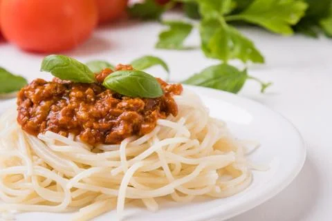 Spaghetti bolognese on white table Stock Photos