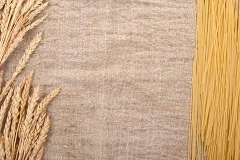Spaghetti on the burlap background and ears Stock Photos