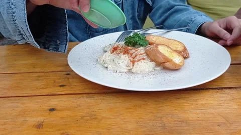 Spaghetti carbonara with bread on a white plate Stock Footage 145463524