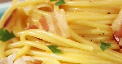 Spaghetti carbonara macro shot. Pasta with pancetta, egg, parmesan cheese. Stock Footage 240911604