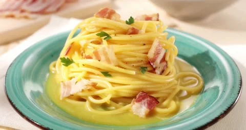 Spaghetti carbonara. Pasta with pancetta, egg, parmesan cheese. angle view. Stock Footage 241954368