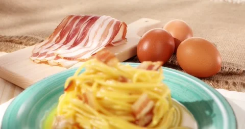 Spaghetti carbonara. Pasta with pancetta, egg, parmesan cheese. Stock Footage 242497857