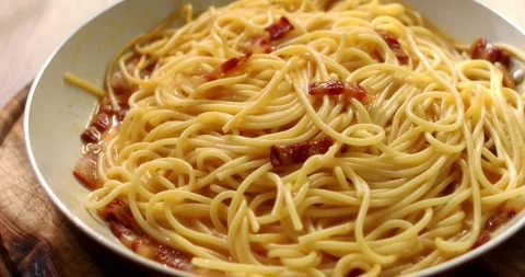 Spaghetti carbonara. Pasta with pancetta, egg, parmesan cheese. Stock Footage 244278119