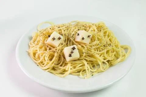 Spaghetti with cheese cubes Stock Photos