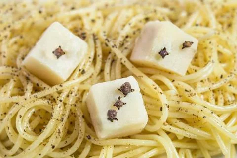 Spaghetti with cheese cubes Stock Photos