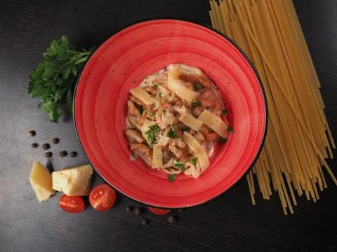 Spaghetti with cheese in a plate on the table Stock Photos