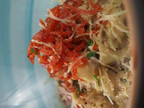 Spaghetti with cheese in a plate on the table Stock Photos