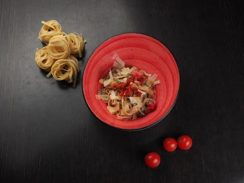 Spaghetti with cheese in a plate on the table Stock Photos