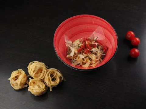 Spaghetti with cheese in a plate on the table Stock Photos