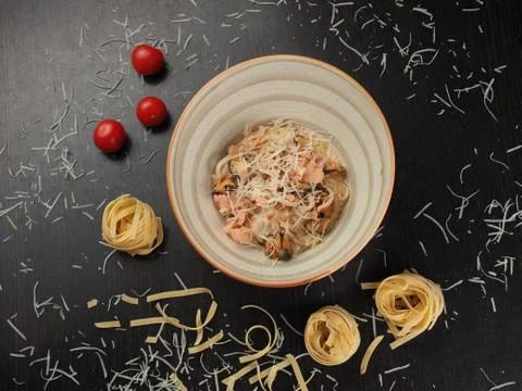 Spaghetti with cheese in a plate on the table Stock Photos