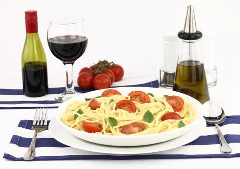 Spaghetti with cherry tomatoes and basil Stock Photos
