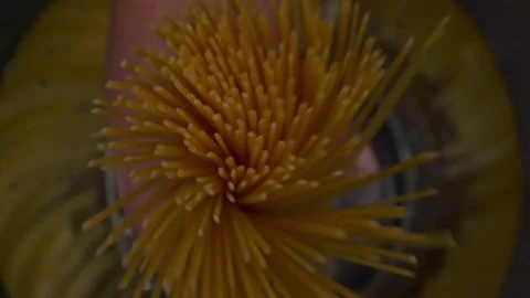 Spaghetti crumbles in the water Stock Footage 140110325
