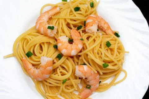 Spaghetti dinner with shrimp Stock Photos